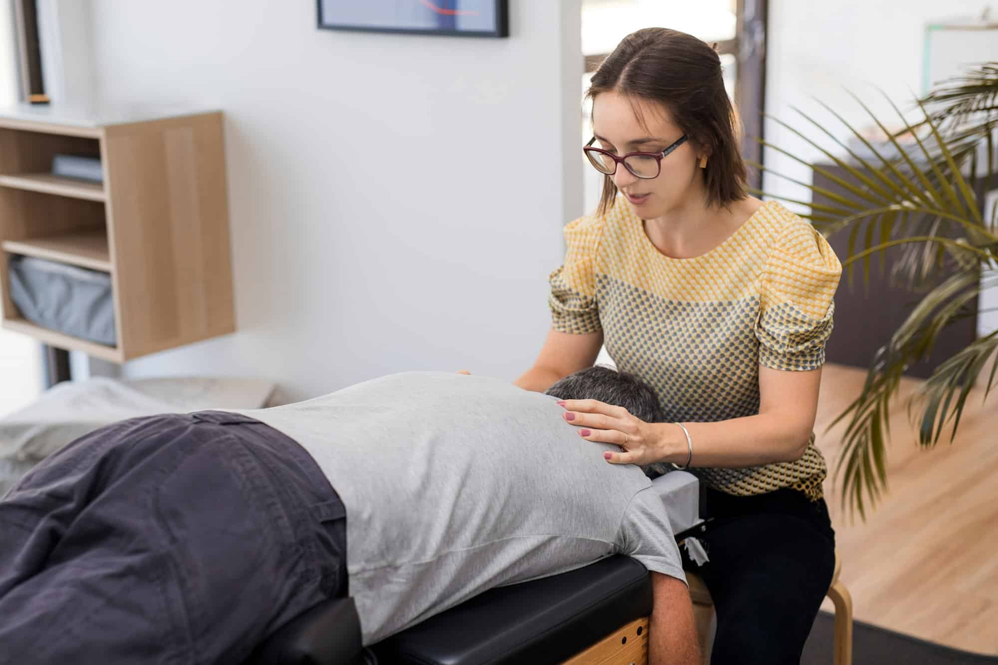 Senior man having chiropractic adjustment.