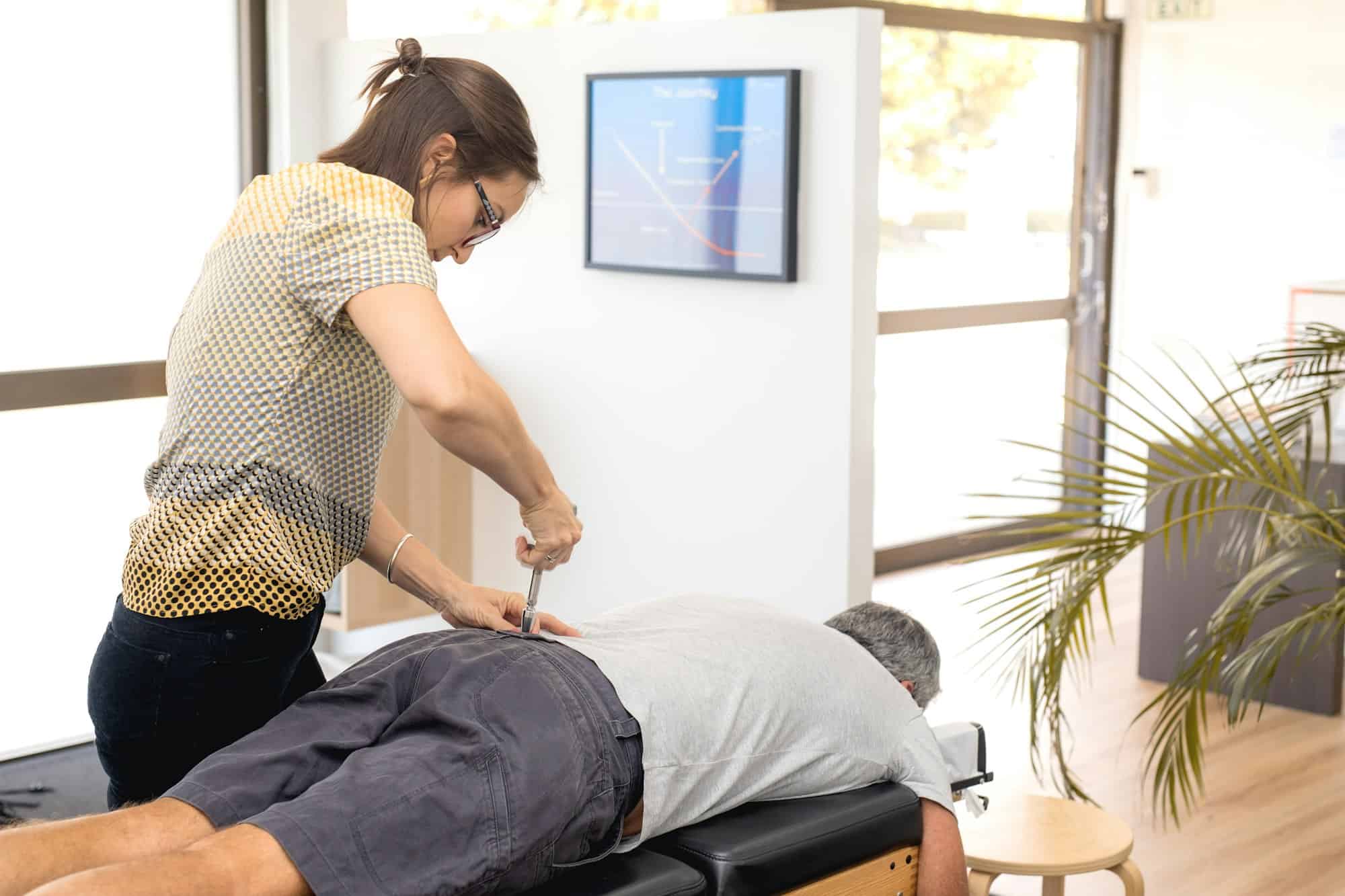 Senior man having chiropractic adjustment.